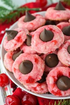 a white plate topped with cookies covered in chocolate