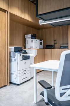 an office with many different types of printer equipment