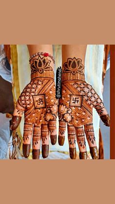 two hands with henna designs on them