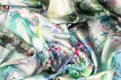 Experience elegance with our luxurious Italian silk charmeuse fabric. Soft and with a light, fluid drape, this fabric is perfect for any special occasion. The unique and vibrant tie-dye print adds a touch of originality, making a statement piece for any wardrobe. Green Silk Scarf For Party, Summer Silk Scarf With Satin Finish, Silk Scarf For Party In Spring, Silk Scarf For Spring Party, Spring Satin Silk Scarf With Satin Finish, Spring Silk Scarf With Satin Finish, Elegant Printed Silk Scarf, Elegant Floral Silk Scarf, Elegant Green Floral Print Silk Scarf