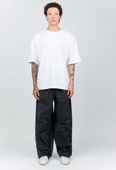 One Size. Fits XS-XLColor: WhiteOversized boxy fitClassic White Tee80% Cotton 20% PolyesterDry Clean OnlyBy The NKC StoreProduct MeasurementsChest: 122cm / 48inLength: 74cm / 29inModel is 185cm / 6'1" wearing size O/S Camo Pant, Black Tank Dress, Black Aviators, Blue Camo, Camo Pants, Boyfriend Tee, Engineered Garments, Mens Outerwear, White Tee