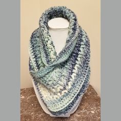 This handcrafted neck-warmer scarf has been expertly knitted using variegated blue yarn. It can be folded in a variety of different ways creating an almost endless array of different looks. Blue Knitted Yarn Scarves, Blue Crochet Scarves For Winter, Blue Knitted Yarn Scarf, Handmade Blue Casual Scarves, Casual Handmade Blue Scarves, Cozy Blue Scarf One Size, Blue Knitted Scarves One Size, Blue Knitted Scarf, One Size, Blue Knitted Scarf One Size