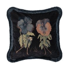 an embroidered pillow with two flowers on the front and one flower on the back, in black velvet