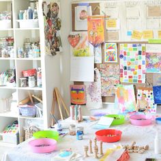 an art studio with lots of crafting supplies on the table