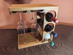 a wooden wine rack with several wine glasses