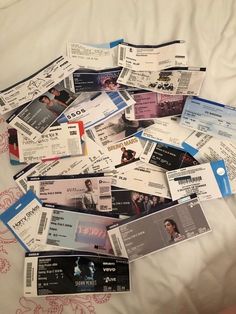 there are many tickets laid out on the bed