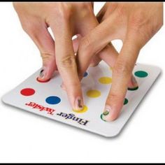 two hands on top of a polka dot board