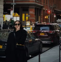 a woman walking down the street talking on her cell phone