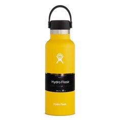 the hydro flask water bottle is yellow and has black lid, with a white logo on