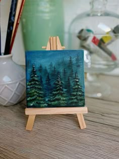 a small easel with a painting on it