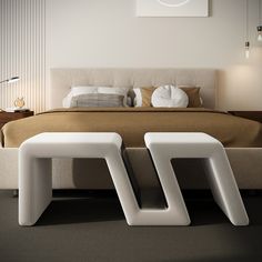 a bed with two white stools in front of it