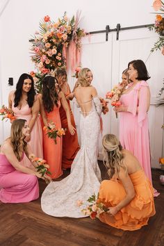 a group of women standing around each other