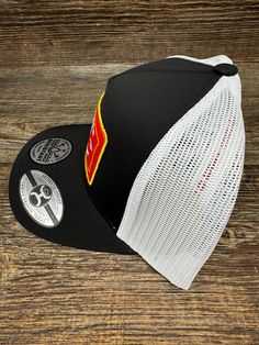 Introducing the 2361T-BKWH "Rank Stock" 5-Panel Trucker Cap by Hooey. This classic cap features a black and white design, with a pop of color from a vibrant red, white, and yellow patch. With an adjustable fit and curved bill, this high-profile cap is perfect for any event. Get your hands on this versatile and stylish cap from Hooey. Hooey Hat, Trucker Cap For Rodeo, One Size Fits Most, Trucker 5-panel Hats For Rodeo, Slip On Work Boots, Collegiate Team-colored Snapback Hat With Flat Bill, Collegiate Team-colored Snapback Trucker Hat, Nocona Boots, Tony Lama Boots, Rocky Boots