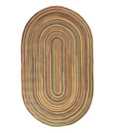 the oval rug is made from braiding and has an oval shape on top of it