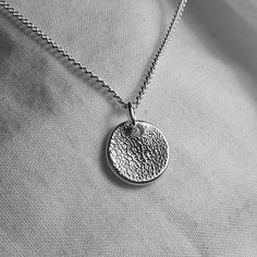 Have your furry friend's nose print captured on a pure silver pendant in the shape of your choice and attached to a sterling silver or leather necklace. Nose prints are unique. much like fingerprints are for humans, so every one is different!  Alternatively I also make pawprint necklaces which can be found here:  https://www.etsy.com/uk/listing/561089333/paw-print-necklace-personalized?click_key=89373383138e71671a1d168c85e3b5ea22d07f4e%3A561089333&click_sum=5360f75f&ga_search_query=pawprint&ref=shop_items_search_3 Once you have placed your order I will send you an easy-to-use kit with enough moulding putty to take two nose prints so that I can choose the best one. It comes with full instructions but if you have any questions or difficulties just get in touch and I will be happy to help :) Dog Nose Print, Dog Lover Jewelry, Paw Print Necklace, Dog Nose, Cat Owner, Shape Of You, Take Two, Pet Memorial, Necklace Personalized