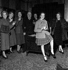 a group of women standing next to each other