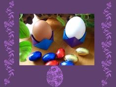 an easter card with two eggs and chocolates on the table next to each other