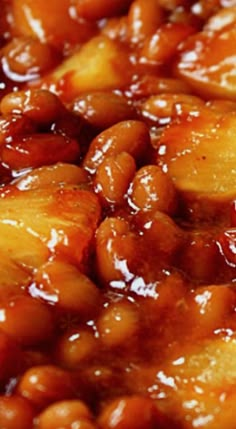 baked beans and pineapples are in a sauce