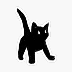 a black cat sticker sitting on top of a white surface with its tail up