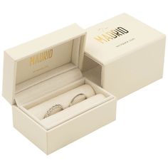 an open box with a wedding ring inside