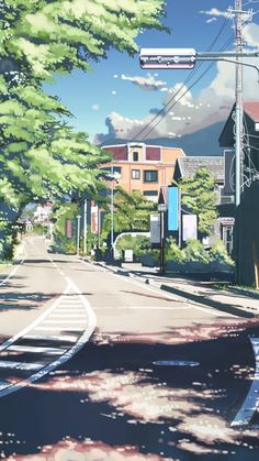 an anime street with buildings and trees on both sides, in front of a blue sky