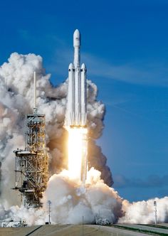 the space shuttle lifts off into the sky