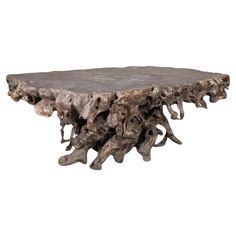 a table made out of tree branches on a white background