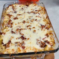 a casserole dish with cheese and meat in it