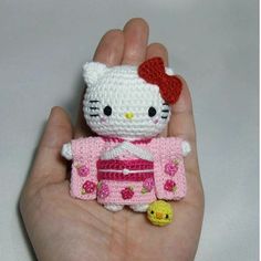 a small hello kitty doll in a pink kimono