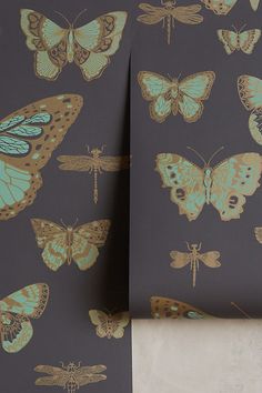 the wall paper is decorated with butterflies and dragonflies on grey, gold, and teal colors