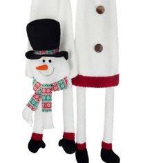 two snowmen are standing next to each other