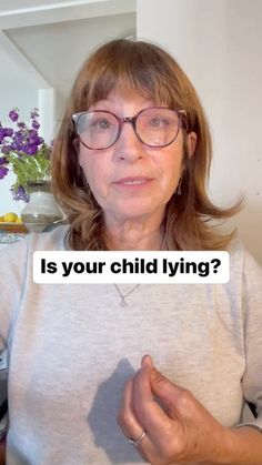 an older woman with glasses is holding up a sign that says is your child lying?