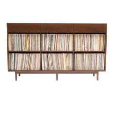 an old record player cabinet with many records on the doors and shelves full of vinyls