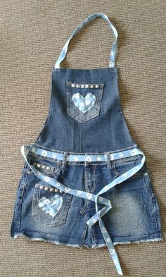 an apron made out of jean shorts with hearts on the front and back, tied together