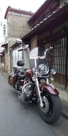 a motorcycle parked in front of a building