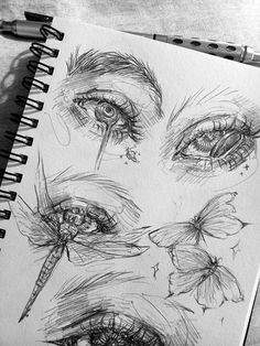 a pencil drawing of eyes and butterflies