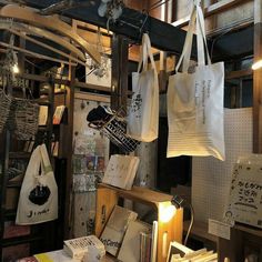 several bags hanging from the ceiling in a shop