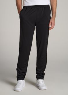 About Our Tall Men's Pants These men's tall athletic pants are a classic take on an athleisure essential. When it comes to athleisure, a good fit is key. You need something that's comfortable enough to relax in yet capable enough to work out in – but as a tall guy, it can be hard to find options that work for your height. You either have to compromise on a baggy fit or settle for lengths that are way too short. Not anymore. We know how hard it is to find quality styles when you're tall, which is Sporty Solid Moisture-wicking Pants, Casual Training Pants With Pockets, Black Athleisure Pants With Straight Hem, Sports Joggers With Side Pockets, Sports Full-length Joggers With Side Pockets, Full-length Sports Joggers With Side Pockets, Full-length Joggers With Side Pockets For Sports, Solid Go-dry Pants For Jogging, Full-length Go-dry Pants For Jogging