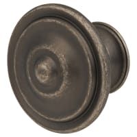 an antique style door knob with a circular design