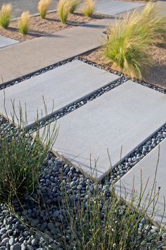 a walkway made out of stones and gravel