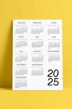 a calendar on a yellow background with black numbers