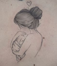 a woman's back with a tattoo on it