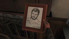 a person holding up a drawing of a man with a beard in front of a fireplace