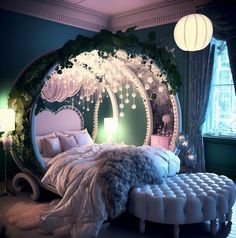 a bedroom decorated in green and white with a circular mirror above the bed that has lights hanging from it