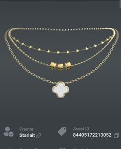 a gold necklace with white stones and chains on the bottom, along with a clover shaped pendant