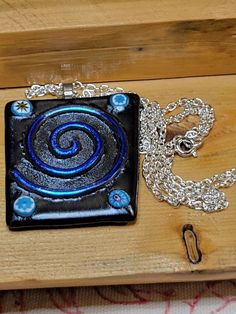 Handmade Gunmetal with Blue Spiral Fused Glass Pendant by Lynn Smythe | FGP01 | eBay Blue Spiral, Contemporary Costumes, Artisan Jewelry Necklaces, Fused Glass Pendant, Handcrafted Artisan Jewelry, Dichroic Glass, Handmade Artisan, Short Video, Glass Pendant