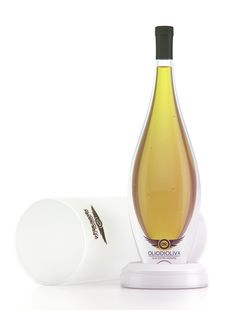 a bottle of wine sitting on top of a white box next to a container with a lid