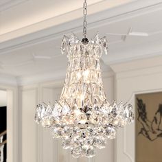 a chandelier hanging from the ceiling in a living room