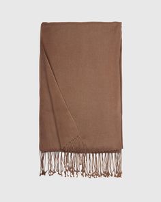 Our Cashmere Silk Scarf combines two of our favorite materials. This super soft, airy scarf has long fringe borders for a classic yet elegant look you'll love wearing around. Elegant Fringe Shawl Scarf, Elegant Fringed Shawl Scarf, Classic Brown Shawl Scarves, Solid Color Fringe Scarf For Fall, Elegant Fringed Scarves For Fall, Classic Solid Color Pashmina Scarves, Classic Solid Color Pashmina Scarf, Elegant Winter Shawl With Tassels, Elegant Fall Shawl With Tassels