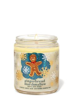 a gingerbread marshmallow candle in a glass jar